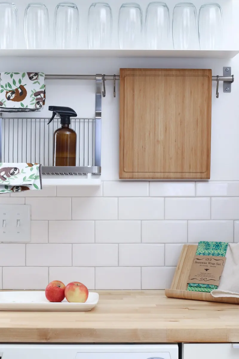 Natural cleaning supplies on a tidy kitchen shelf